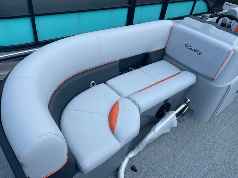 Slide: The Image of 2025 Bentley Pontoons Bolt boat with luxurious seating and modern design. - 6