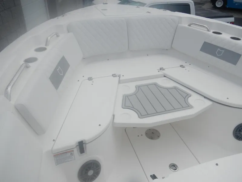 Slide: The Image of 2025 Sea Fox 268 Commander boat interior with cushioned seating and storage compartments. - 14