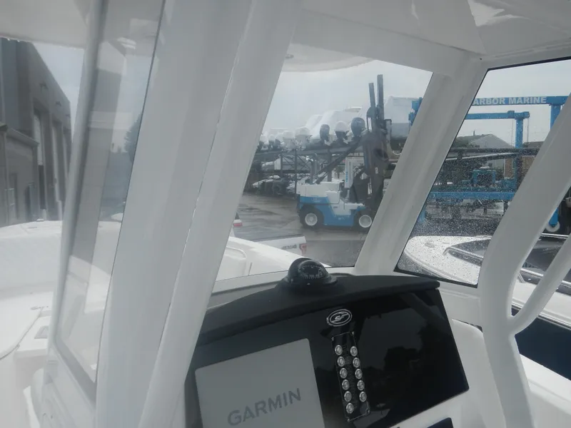 Slide: The Image of 2025 Sea Fox 268 Commander boat dashboard with Garmin navigation system. - 16