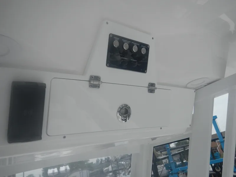 Slide: The Image of 2025 Sea Fox 268 Commander control panel and storage compartment. - 17