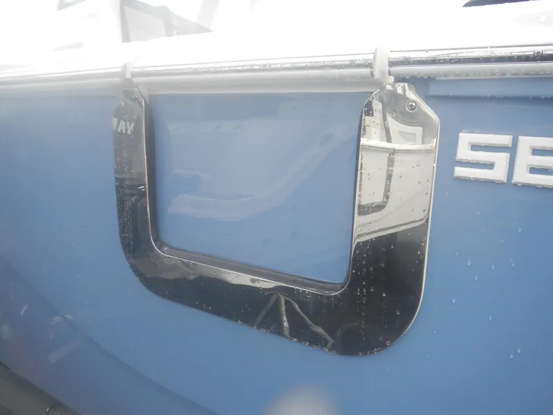 Slide: The Image of 2025 Sea Fox 268 Commander boat with blue hull and stainless steel details. - 5