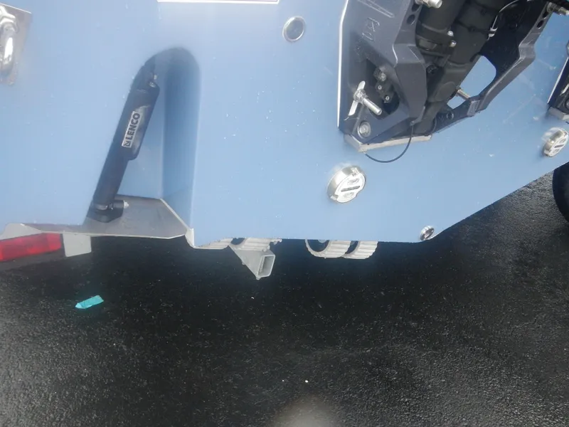 Slide: The Image of 2025 Sea Fox 268 Commander boat stern with motor and hydraulic components. - 8