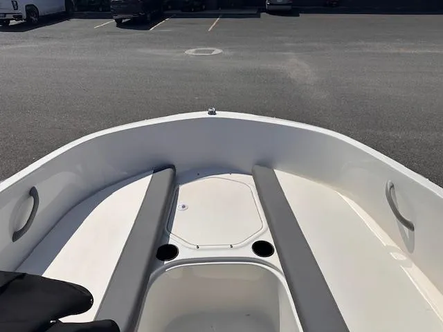 Slide: The Image of 2024 Bayliner E16LE boat interior with seating and storage compartments. - 4