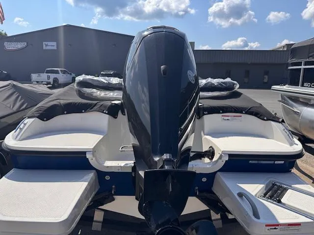 Slide: The Image of 2024 Bayliner E16LE boat rear view with outboard motor and swim platforms. - 5