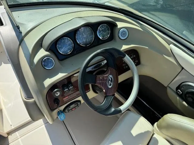 Slide: The Image of 2005 Sea Ray 200 Select boat dashboard with steering wheel and instrument panel. - 10