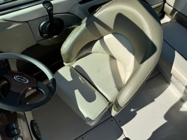 Slide: The Image of 2005 Sea Ray 200 Select boat interior with steering wheel and captain's chair. - 11