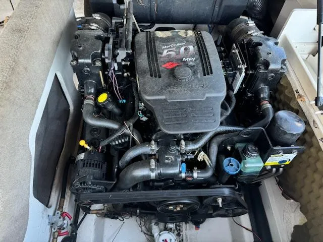 Slide: The Image of 2005 Sea Ray 200 Select boat engine compartment with MerCruiser 5.0 MPI engine. - 16
