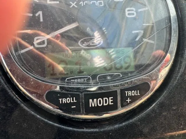 Slide: The Image of Close-up of 2005 Sea Ray 200 Select boat tachometer and control buttons. - 17