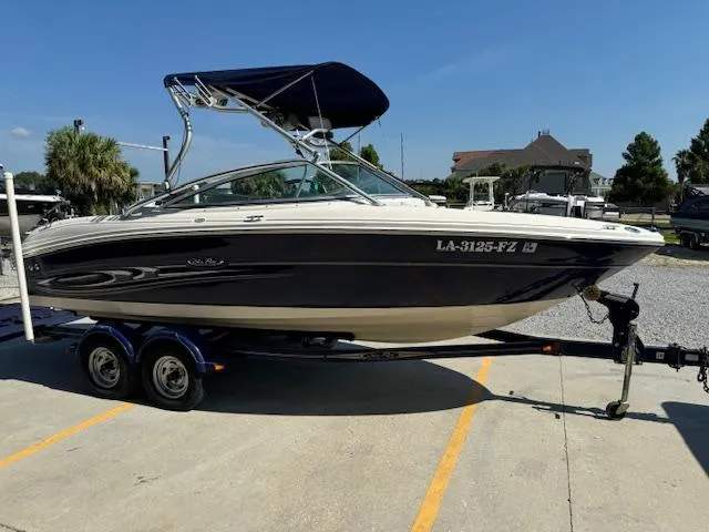 Slide: The Image of 2005 Sea Ray 200 Select boat on trailer in parking lot. - 3