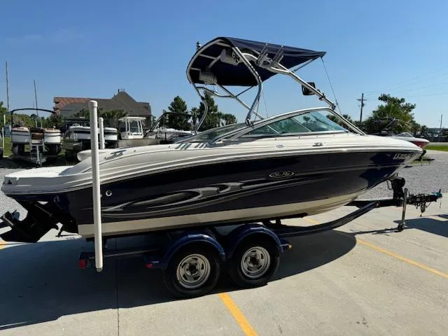 Slide: The Image of 2005 Sea Ray 200 Select boat on a trailer in a marina. - 6