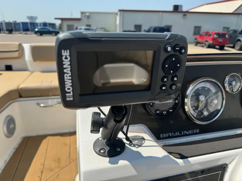 Slide: The Image of Open storage compartment on 2023 Bayliner DX 2000 boat, showcasing interior details. - 12