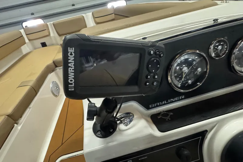 Slide: The Image of 2023 Bayliner DX 2000 dashboard with Lowrance navigation system and gauges. - 26