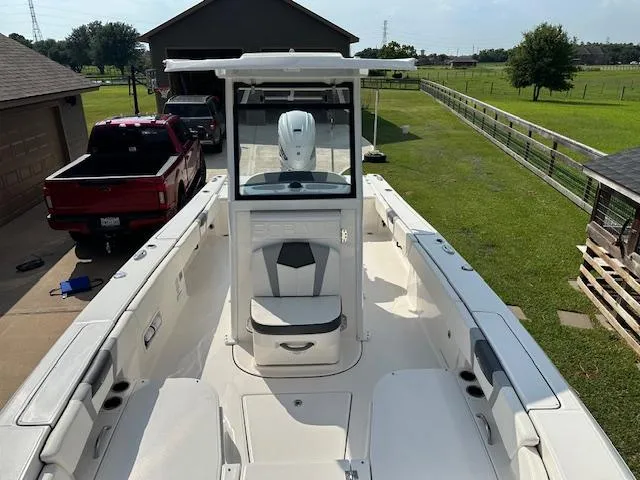 Slide: The Image of 2022 Robalo 266 Cayman boat in driveway, view from bow. - 10