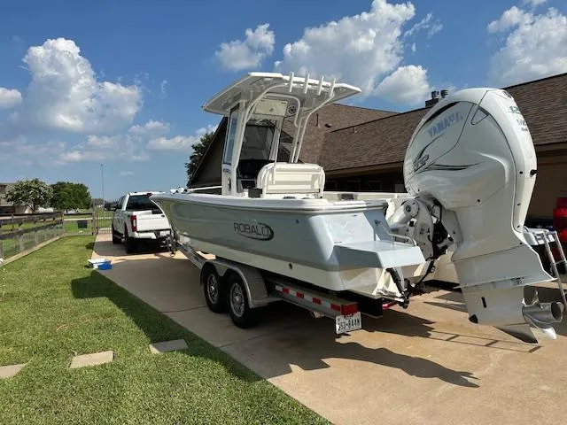 Slide: The Image of 2022 Robalo 266 Cayman boat on trailer with Yamaha outboard motor. - 2