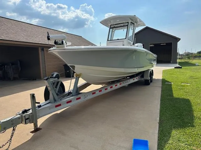Slide: The Image of 2022 Robalo 266 Cayman boat on trailer in driveway. - 4