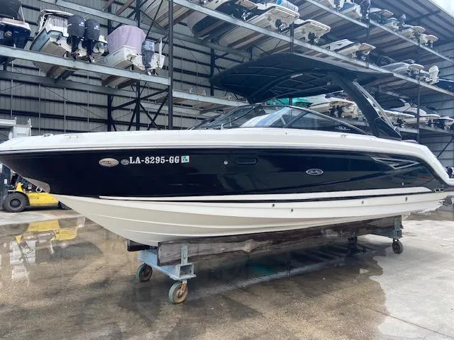 Slide: The Image of 2017 Sea Ray 280 SLX boat in storage facility. - 1