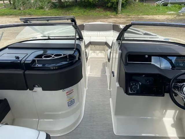 Slide: The Image of 2017 Sea Ray 280 SLX boat interior with dual consoles and seating. - 13