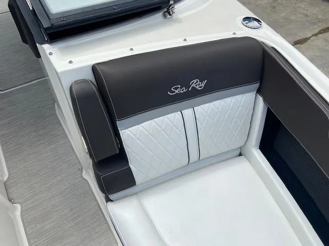 Slide: The Image of 2017 Sea Ray 280 SLX boat interior with black and white seating. - 17