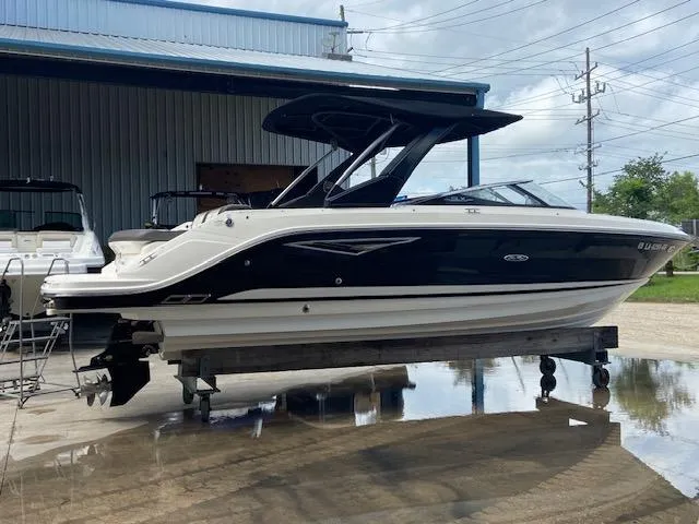 Slide: The Image of 2017 Sea Ray 280 SLX boat on a trailer outside a warehouse. - 3