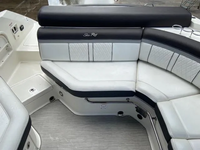 Slide: The Image of 2017 Sea Ray 280 SLX boat interior with white and black seating. - 4