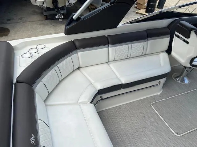 Slide: The Image of 2017 Sea Ray 280 SLX boat interior with white and black seating. - 9
