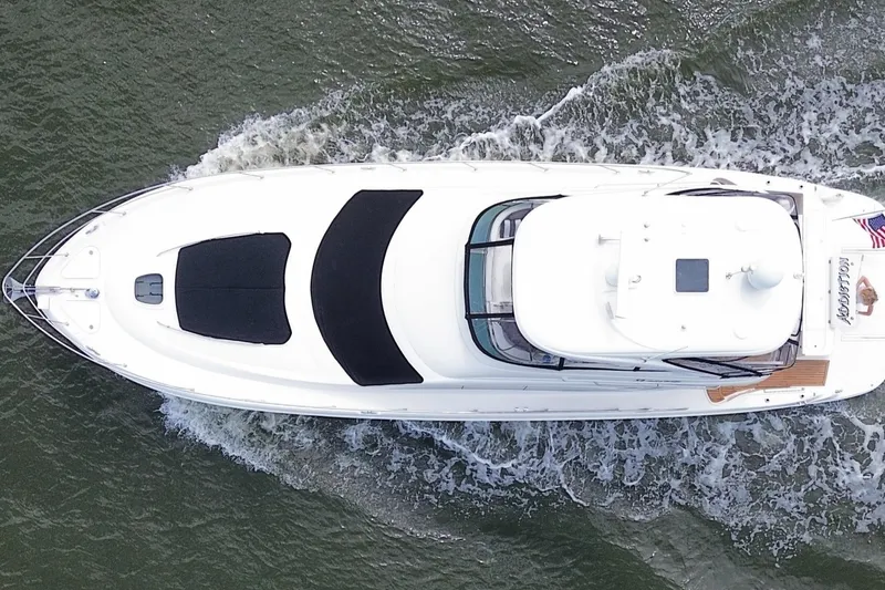 Slide: The Image of Top view of a 2007 Sea Ray 52 Sedan Bridge yacht cruising on water. - 14