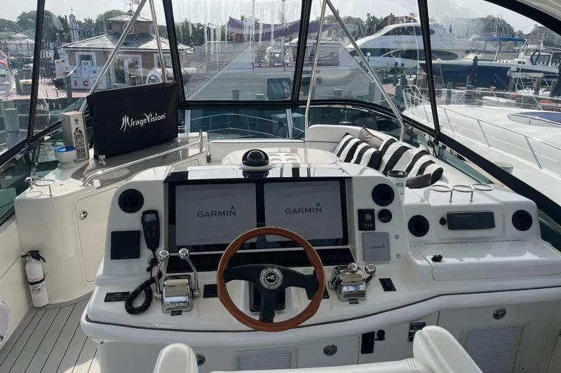 Slide: The Image of 2007 Sea Ray 52 Sedan Bridge helm with Garmin navigation systems at marina. - 15