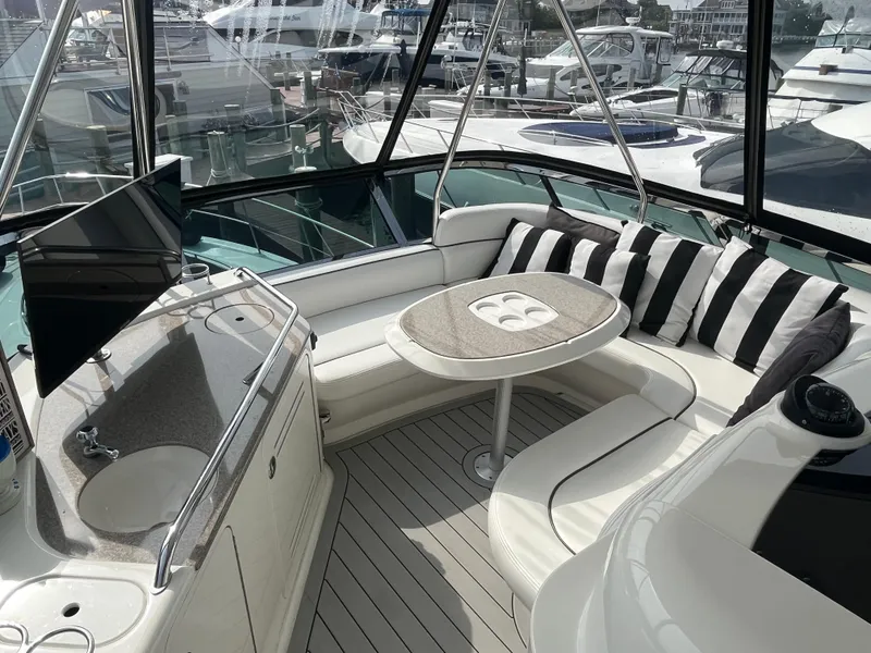 Slide: The Image of Luxurious interior of a 2007 Sea Ray 52 Sedan Bridge yacht with seating and a table. - 2