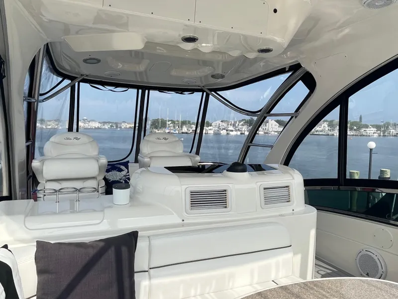 Slide: The Image of Interior of 2007 Sea Ray 52 Sedan Bridge yacht with panoramic windows and plush seating. - 21