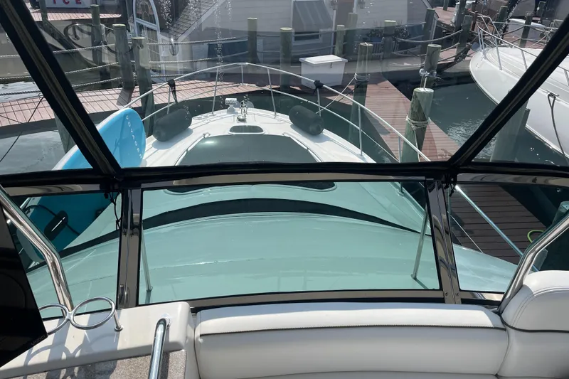 Slide: The Image of 2007 Sea Ray 52 Sedan Bridge yacht docked at marina, view from helm. - 24