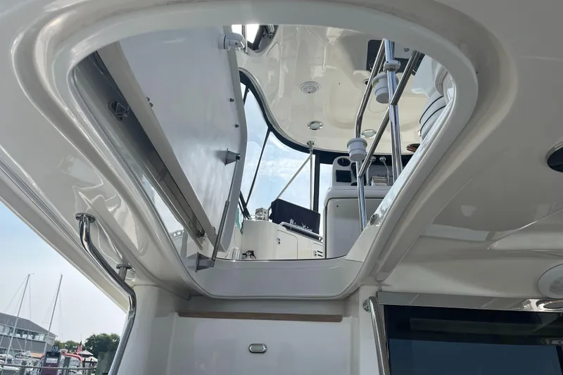 Slide: The Image of 2007 Sea Ray 52 Sedan Bridge yacht interior view with stairs to upper deck. - 26