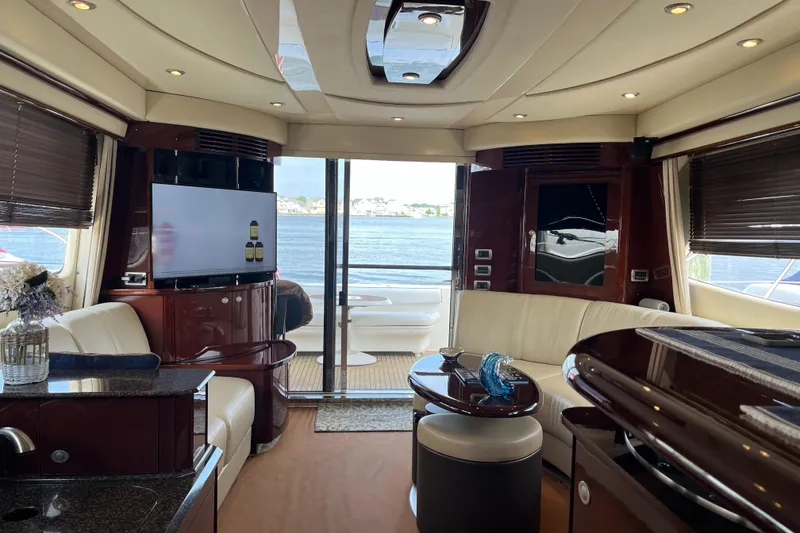 Slide: The Image of Luxurious interior of 2007 Sea Ray 52 Sedan Bridge yacht with waterfront view. - 3