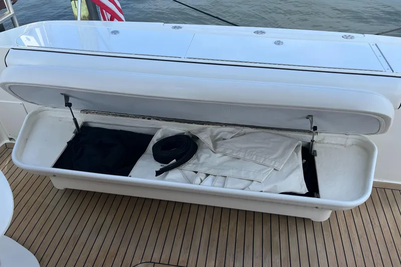 Slide: The Image of Open storage compartment on a 2007 Sea Ray 52 Sedan Bridge yacht. - 31
