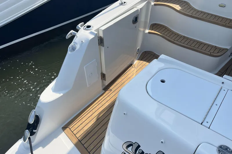 Slide: The Image of 2007 Sea Ray 52 Sedan Bridge yacht deck with teak flooring and steps. - 33