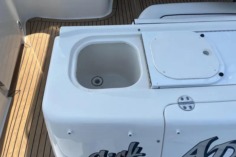 Slide: The Image of 2007 Sea Ray 52 Sedan Bridge deck with built-in sink and storage. - 36