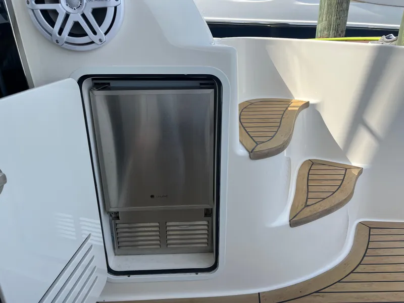 Slide: The Image of 2007 Sea Ray 52 Sedan Bridge yacht interior with built-in refrigerator and wooden steps. - 39