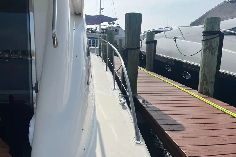 Slide: The Image of 2007 Sea Ray 52 Sedan Bridge yacht docked at marina. - 40