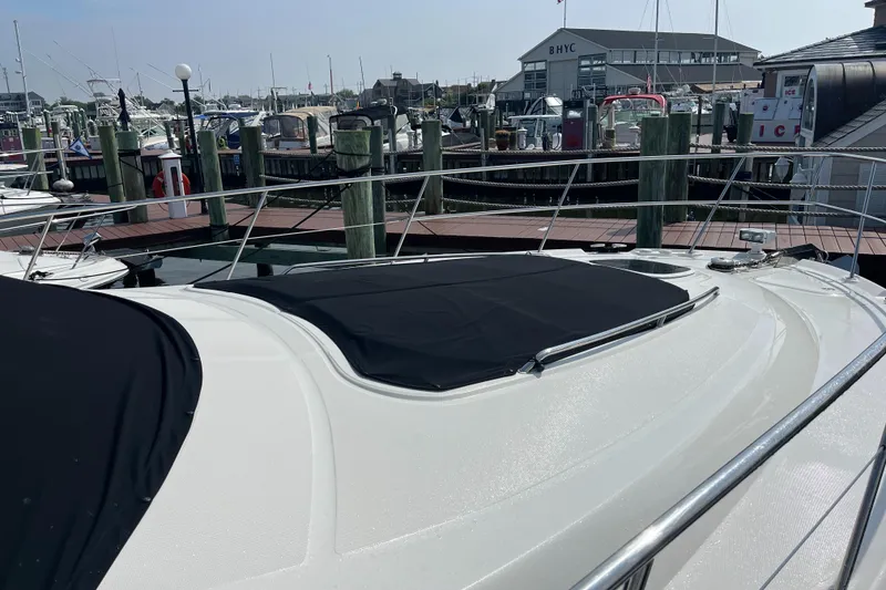 Slide: The Image of 2007 Sea Ray 52 Sedan Bridge yacht docked at a marina. - 41