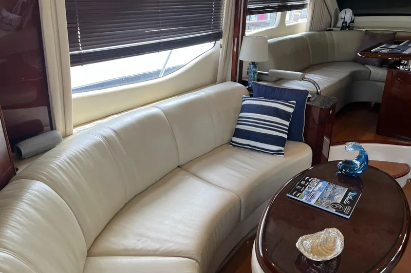 Slide: The Image of Luxurious interior of 2007 Sea Ray 52 Sedan Bridge with leather seating and modern decor. - 46
