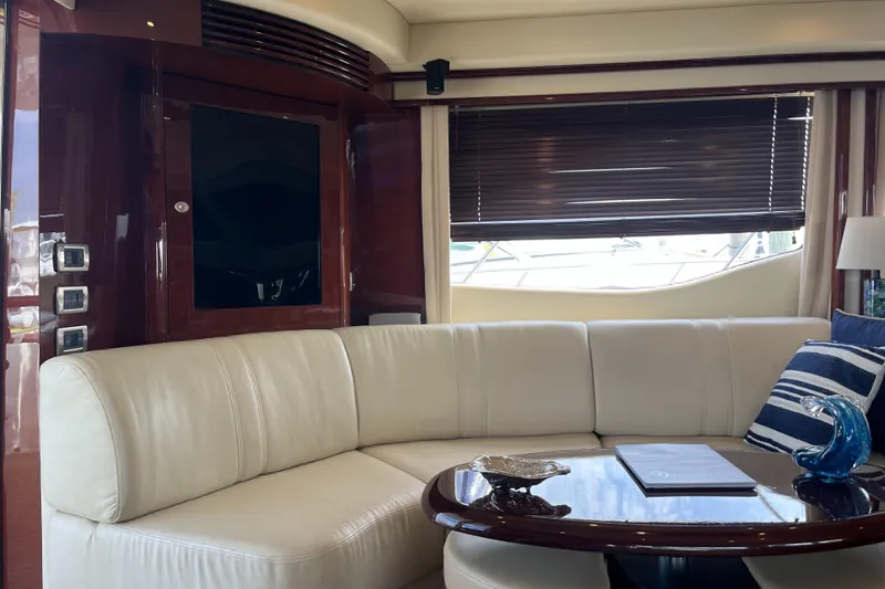 Slide: The Image of Luxurious interior of 2007 Sea Ray 52 Sedan Bridge yacht with white leather seating. - 47