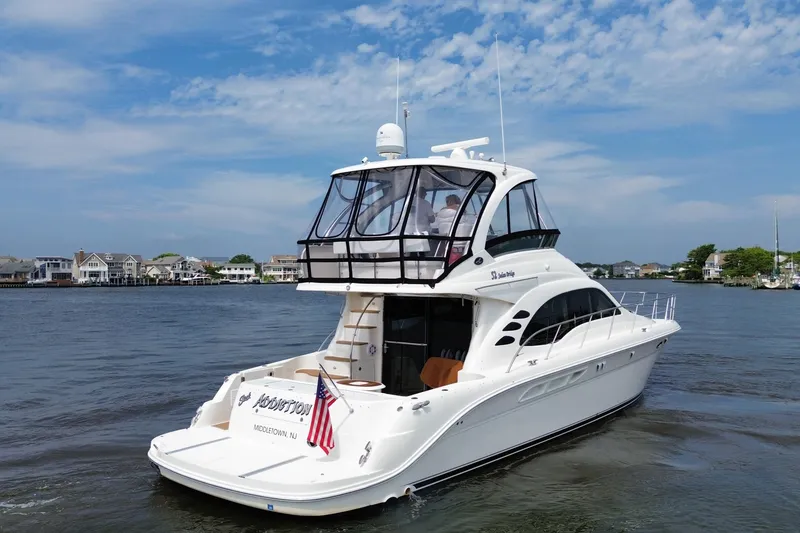 Slide: The Image of 2007 Sea Ray 52 Sedan Bridge yacht cruising on a sunny day. - 7