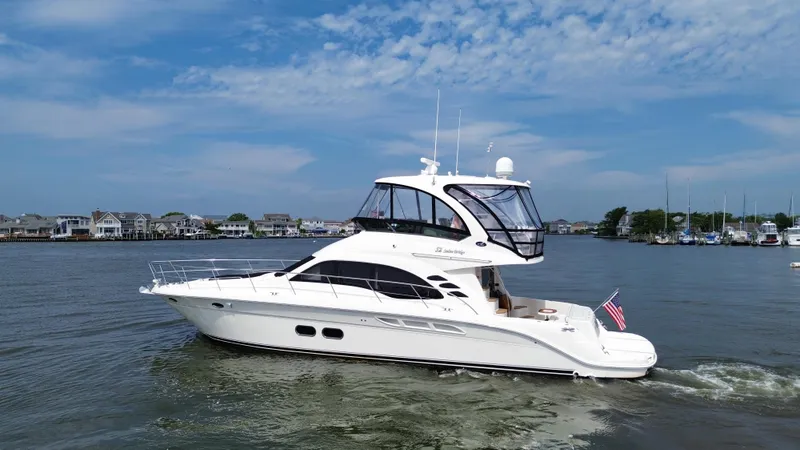 Slide: The Image of 2007 Sea Ray 52 Sedan Bridge yacht cruising on a sunny day. - 9