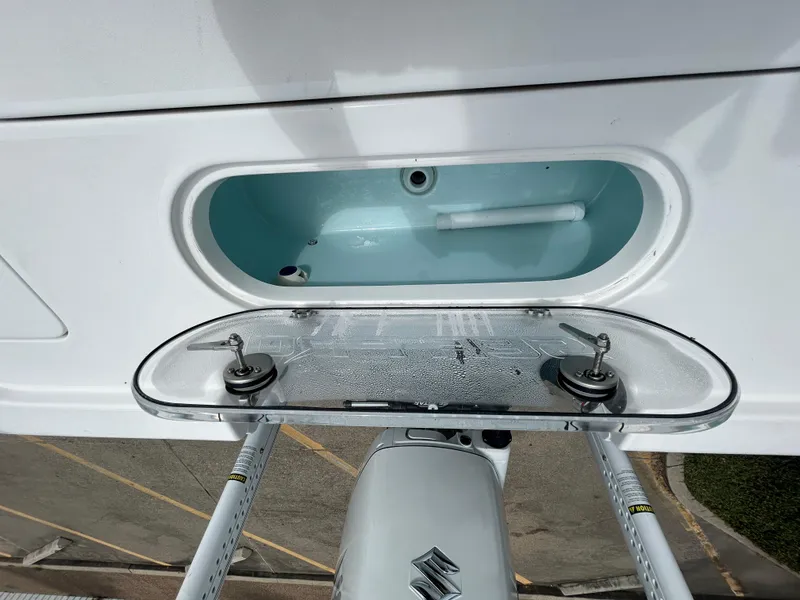 Slide: The Image of 2024 Sea Pro 250 DLX boat with Suzuki engine and livewell. - 12