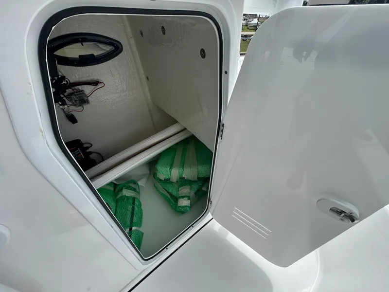 Slide: The Image of Open storage compartment on 2024 Sea Pro 250 DLX boat. - 21