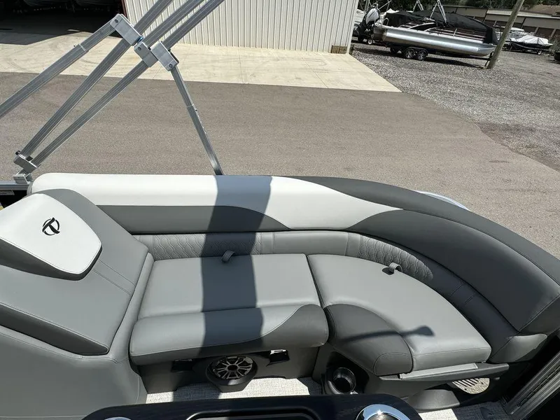 Slide: The Image of 2025 Tahoe LTZ 2385 QL pontoon boat with luxurious gray seating. - 12