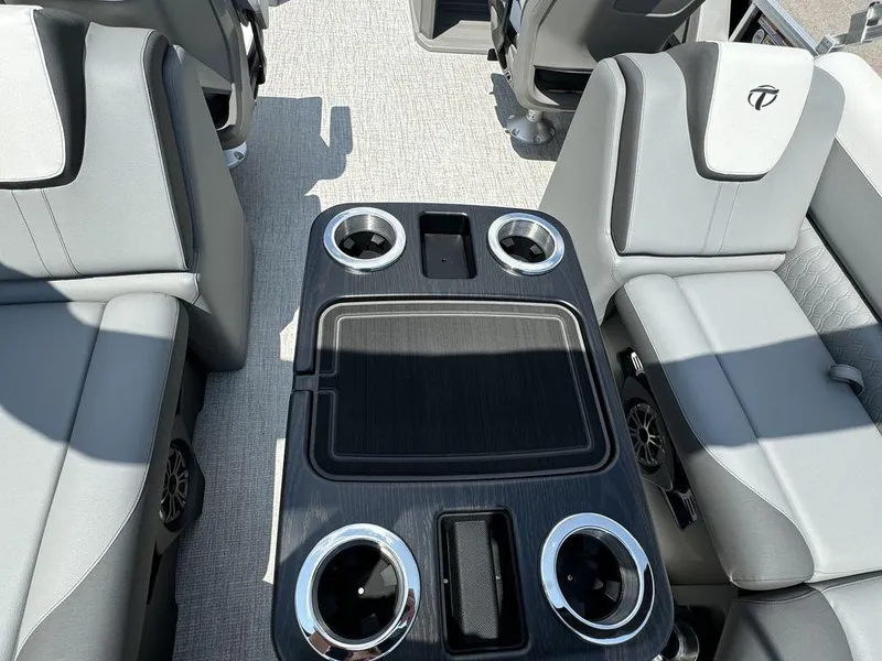 Slide: The Image of Interior of 2025 Tahoe LTZ 2385 QL pontoon boat with cup holders and seating. - 13