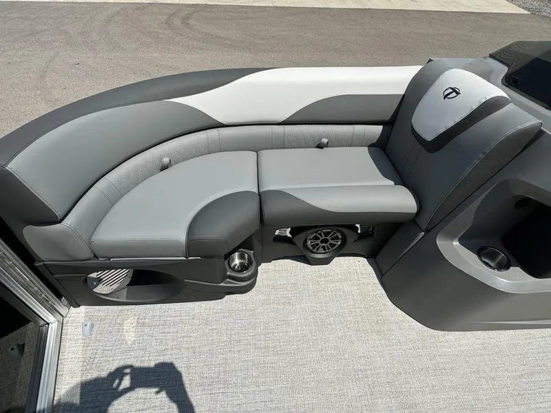 Slide: The Image of 2025 Tahoe LTZ 2385 QL boat interior with gray and black seating. - 4