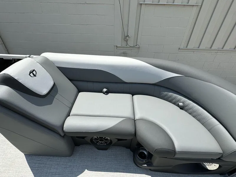 Slide: The Image of 2025 Tahoe LTZ 2385 QL boat interior with luxurious gray seating. - 5