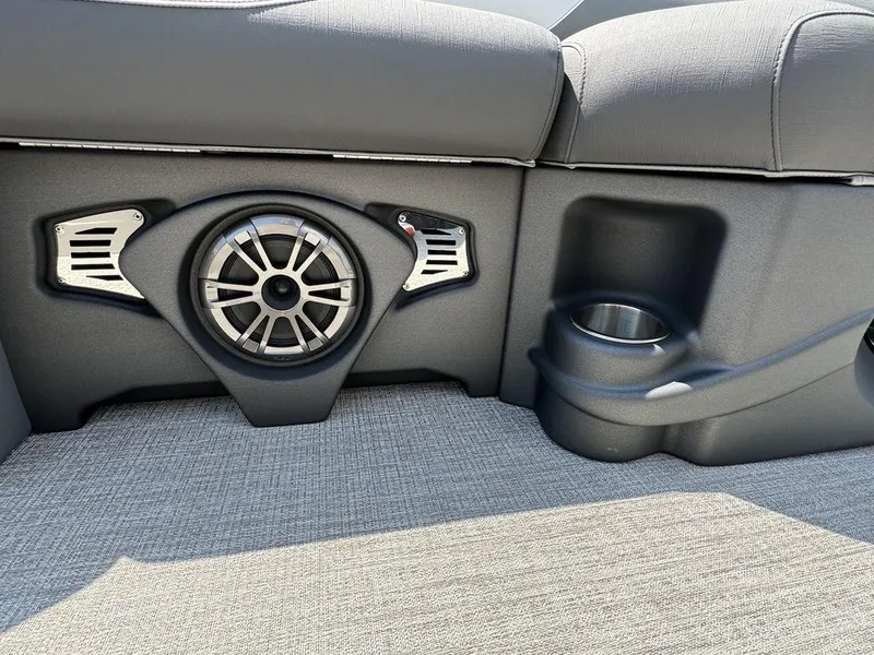 Slide: The Image of 2025 Tahoe LTZ 2385 QL boat interior with speaker and cup holder. - 6