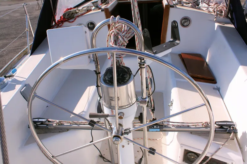 Slide: The Image of Cockpit of 1988 Tartan 34-2 Scheel Keel sailboat with steering wheel and navigation instruments. - 13